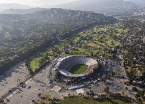 Overview of the historic Rose Bowl Stadium, along with surrounding parking and mountains