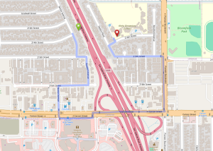 Directional map showing how the 605 freeway forces a pedestrian to walk more than a mile out of the way to reach a school on the other side of the freeway